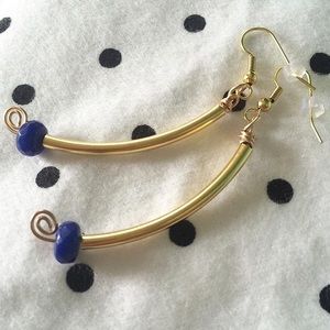 Simple gold earrings with a splash of blue